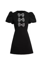 vanessa bow puff sleeve mini dress in black
