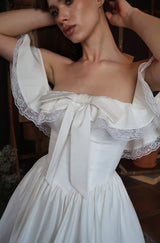 alison Off-shoulder bow lace mini dress in white