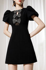 vanessa bow puff sleeve mini dress in black