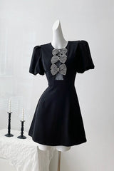 vanessa bow puff sleeve mini dress in black