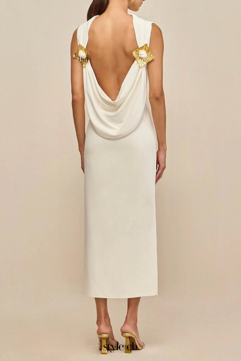 white sleeveless backless knit midi dress with two pleated golden embellishments