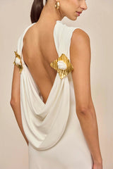 white sleeveless backless knit midi dress with two pleated golden embellishments