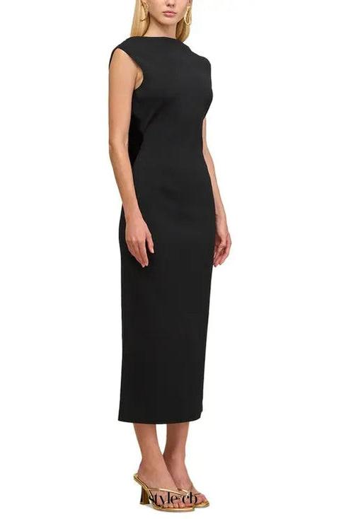 black sleeveless backless knit midi dress with two pleated golden embellishments